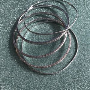Five silver Bracelets